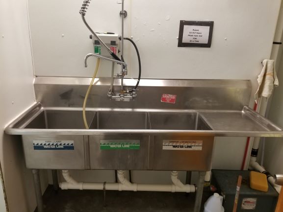 Three-bay commercial wash sink at the Brookhaven kitchen